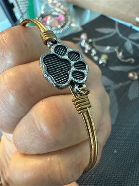 Luca & Dani metal Wire Bangle Bracelet in Antique Gold Tone.  Paw  print.